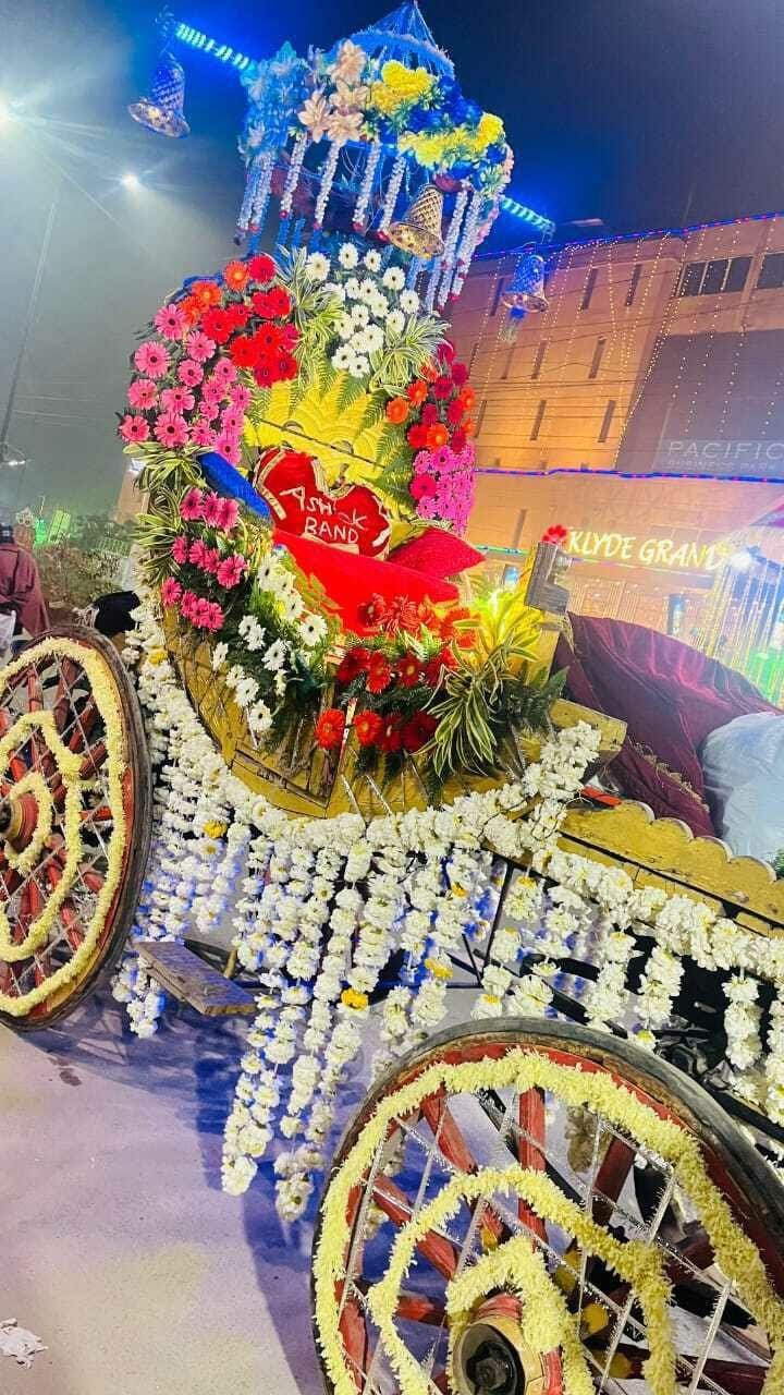 Baraat procession with decorated kalash canopies and horses